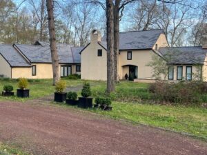 Franco Roofing Inc. cedar shake roof installation on a stone hillside outbuilding in Bucks County, PA