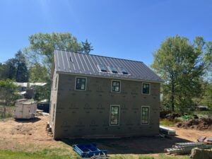 Black standing seam metal roof on a new home in Buckingham, Pennsylvania